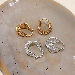 Elegant twisted hollow geometric hoop earrings with sparkling zircon accents in gold and silver