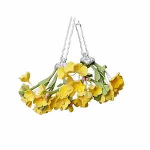 Elegant New Chinese style hairpins featuring yellow clay flowers and green leaves for women