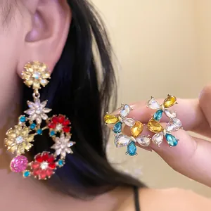 Detailed view of colorful zircon flower earrings with a vintage French luxury design