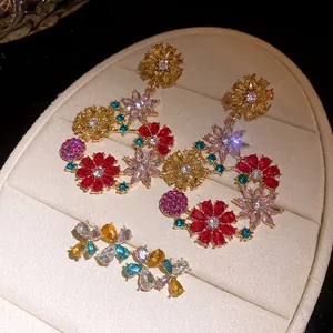 Close-up of vibrant multicolored floral drop earrings with sparkling cubic zirconia