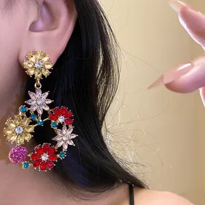 Detailed view of elegant vintage floral drop earring featuring multi-colored sparkling zirconias