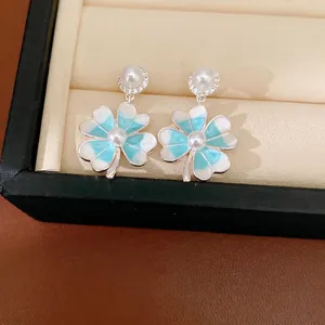 Silver needle zircon enamel four-leaf clover earrings with blue petals and pearls