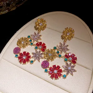 Detailed view of vintage-style floral drop earrings with vibrant multi-colored zircons