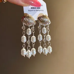 Vintage shell pearl tassel earrings with golden metallic finish and silver needles