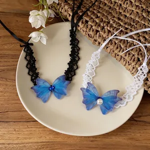 Lace choker necklaces featuring chiffon butterfly pendants with pearl and gem accents.