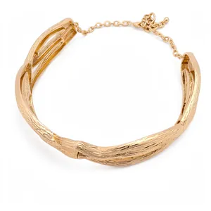 Gold twisted metal choker necklace with elegant wrinkled minimalist statement design