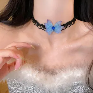 Detail showing a black lace choker with a blue chiffon butterfly ornament on a model