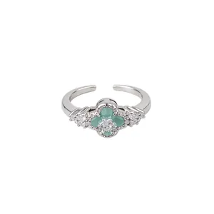 Elegant silver adjustable open ring featuring a green flower and sparkling zircon stones