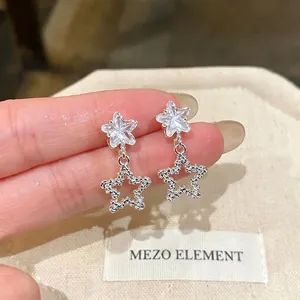 Korean style minimalist silver needle star earrings with dangling hollow design for women