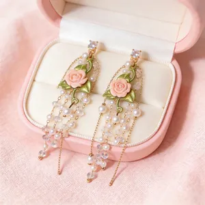 Elegant French style rose earrings featuring pearl tassels and shimmering zircons