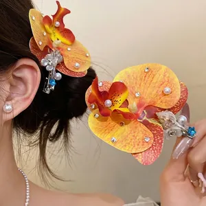 Exquisite handmade fabric orchid hair clip with pearls and shells for holiday beach hair styling