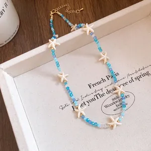 Detailed view of bohemian beaded necklace with crystal beads and starfish charms