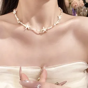 Close-up detail of a Bohemian starfish beaded necklace featuring delicate crystal accents