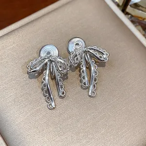 Elegant silver lace bow clip-on earrings for women without piercings, stylish jewelry