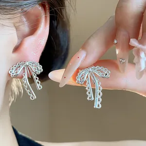 Exquisite silver lace bow clip-on earrings for non-pierced ears, elegant design