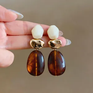 Vintage Maillard style geometric resin drop earrings in cream, gold, and amber brown colors