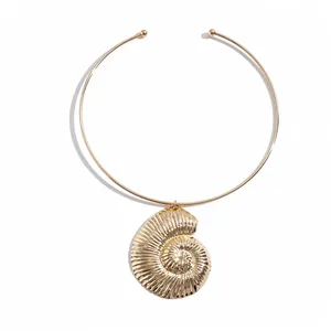 Gold metallic choker necklace with textured seashell pendant in retro style
