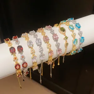 Detailed macro view of 18k gold plated bracelets with colorful oval zircon gemstones