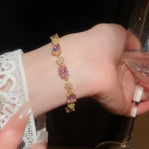 Close-up of elegant 18k gold plated pink zircon oval flower bracelet on wrist