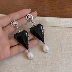 Elegant vintage black resin heart drop earrings with white baroque pearl accents for women