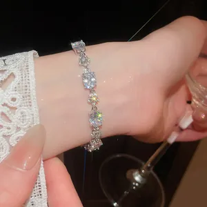 Close-up of sparkling zircon oval flower bracelet on wrist with elegant lighting