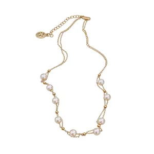 Elegant 18k gold plated necklace featuring lustrous pearls and double chain design