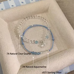 Elegant handmade blue cord and clear quartz beaded bracelet with silver fish charm