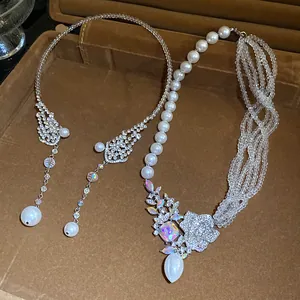 Detailed view of ornate rhinestone pearl and crystal beaded choker necklaces for women.