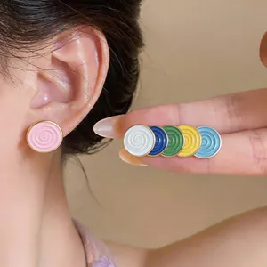 Colorful enamel spiral stud earrings shown in a variety of vibrant pastel colors