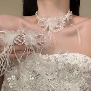 Close-up of an elegant white feather and pearl flower jewelry set worn by a model