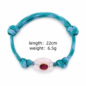 Detail view of woven teal bracelet with pink natural stone and parameters