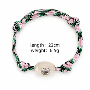 Detail of Bohemian woven rope bracelet with lucky eye stone and weight specifications