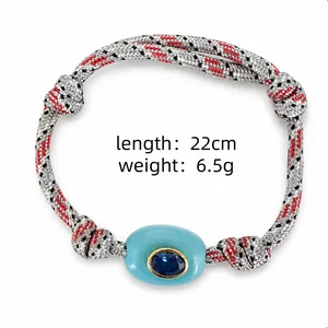 Bohemian braided rope bracelet with blue lucky eye stone showing length and weight details
