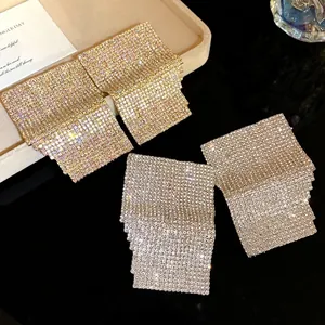 Luxury sparkling rhinestone geometric square stud earrings in gold and silver finish.