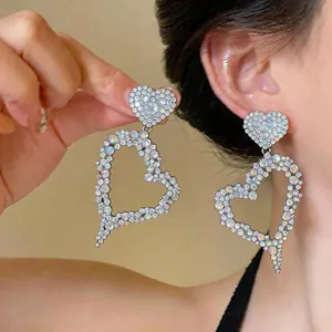 Exaggerated iridescent rhinestone hollow heart-shaped dangle earrings detail view
