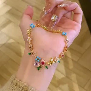 Elegant 18k gold plated bracelet featuring colorful zircon flowers and dainty pearls