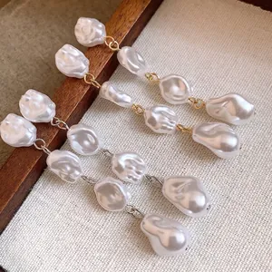 Orecchini eleganti vintage francesi con nappine di perle barocche in finitura oro e argento