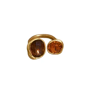 Vintage gold open ring with dual amber oval stones and a minimalist organic design