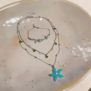 Exquisite teal starfish and shell jewelry set with green zircon accents for resort style