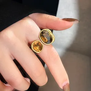 Detail view of a vintage Maillard style adjustable open ring with amber crystals
