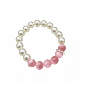 Elegant cat-eye and pearl beaded bracelet in sweet pink and white dopamine style