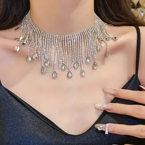 Detailed view of a luxury rhinestone fringe necklace with sparkling teardrop crystal drops