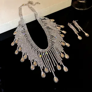 Close-up detail of silver-toned rhinestone fringe necklace and teardrop earrings set