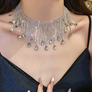 Macro view of a sparkling rhinestone fringe necklace with elegant water-drop pendants
