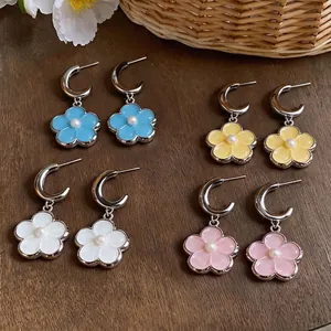 Dopamine style sweet resin flower earrings with central pearls on silver-tone hoops