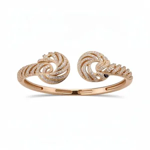 Elegant 18K gold plated open bangle featuring twisted swirl designs and pavé zircon stones