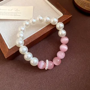 Handmade elegant pearl and pink cat-eye stone beaded bracelet with sweet feminine aesthetic