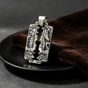 Detailed view of vintage stainless steel pendant with intricate Egyptian Anubis carving