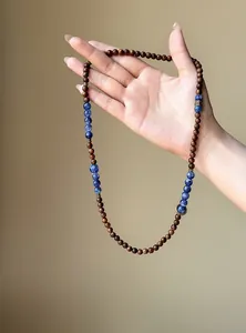 Detailed view of handcrafted New Chinese style necklace with wood and blue beads