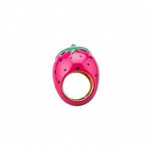 Vibrant pink enamel strawberry shaped ring with green leaf accents on clean white background